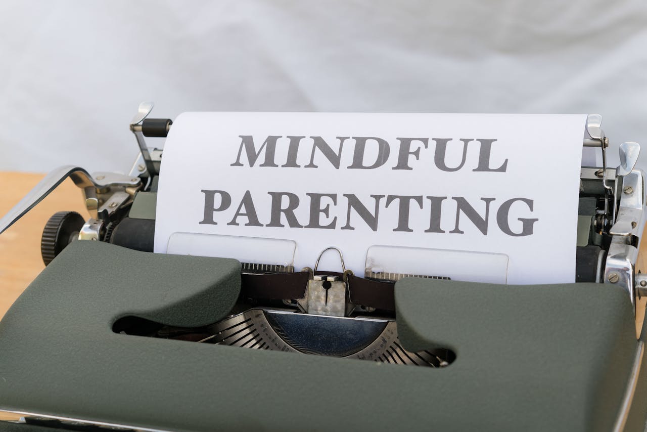 A close-up of a vintage typewriter displaying the message Mindful Parenting.